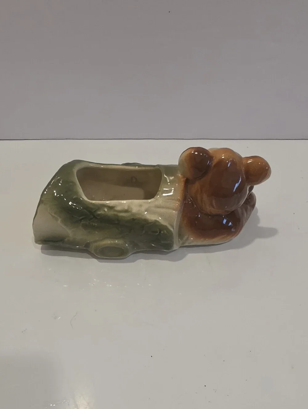 Vintage Ceramic Planter Featuring A Whimsy Bear Lounging Next To A Log.